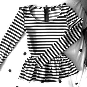 Adorable long sleeved peplum top with side cutouts